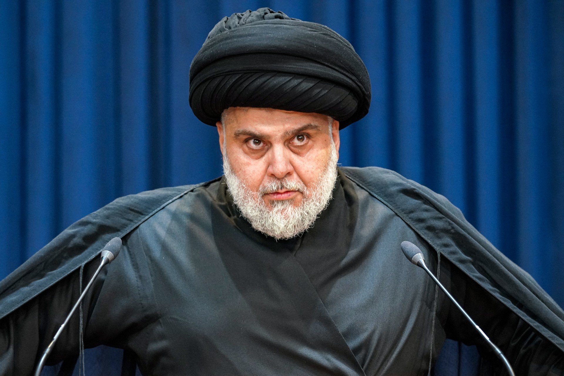 Muqtada al-Sadr gives a speech in Najaf on 30 August demanding his followers withdraw (AFP)