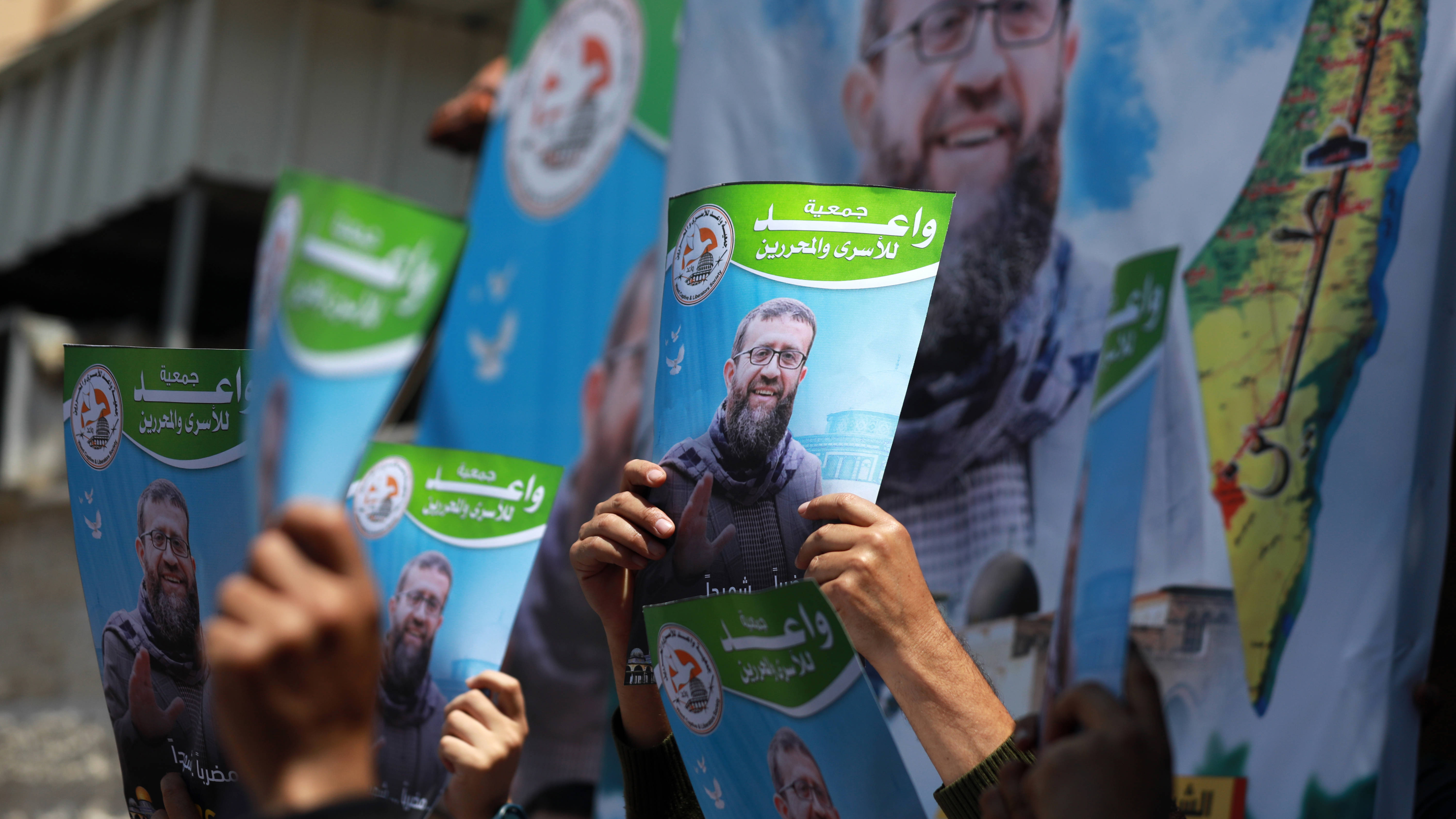 Palestinians in  Gaza City hold protest after death of Khader Adnan in Israeli custody on 2 May 2023 (Reuters)