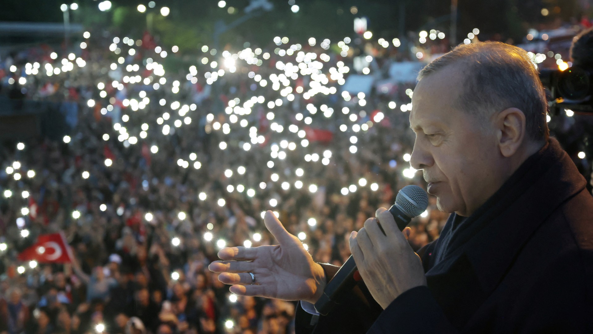 Turkish President Recep Tayyip Erdogan addresses his supporters following early results for the second round of the presidential election in Istanbul, on 28 May (Reuters)