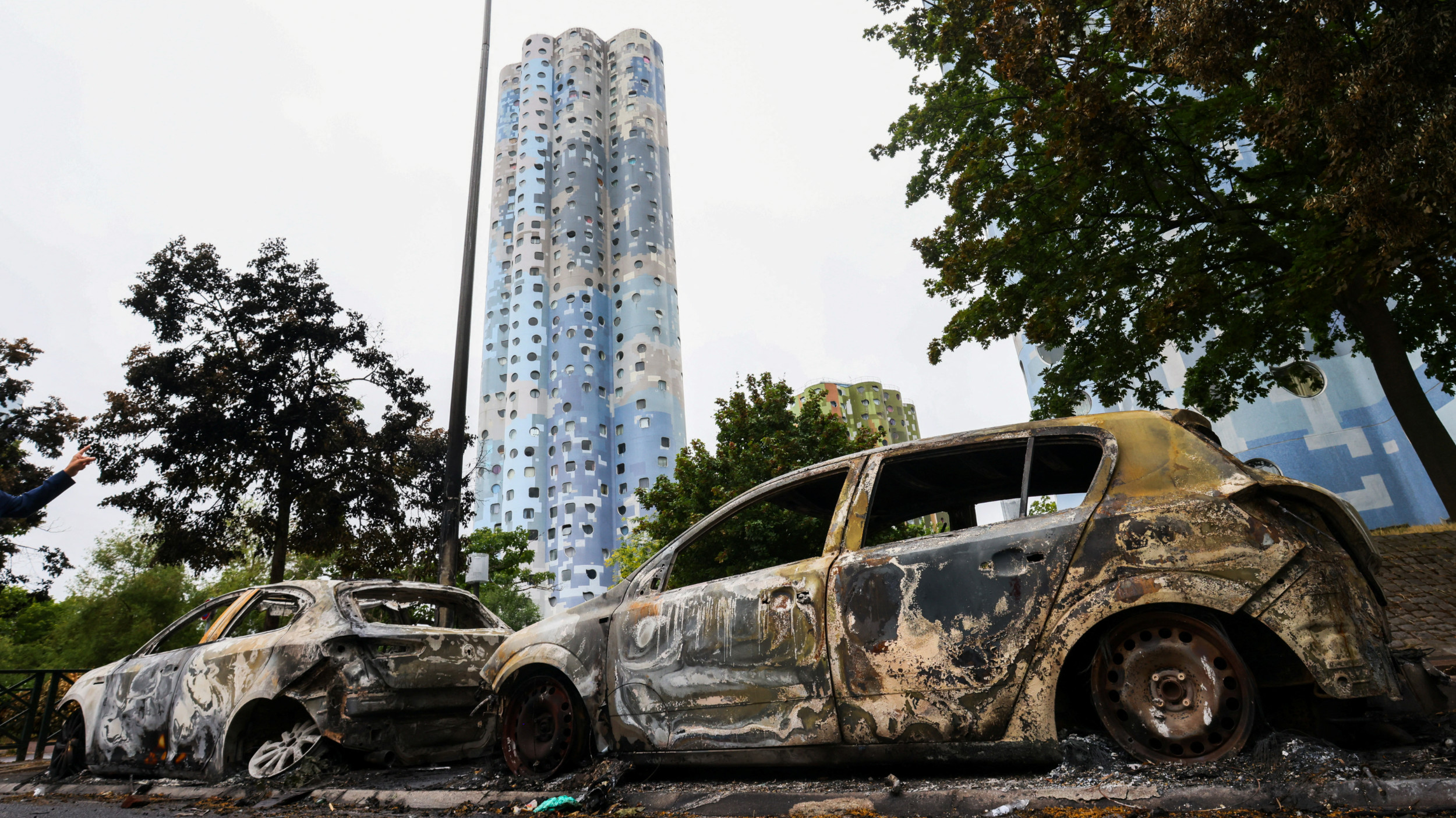 A view of cars burnt during a night of clashes between protesters and police in Nanterre, Paris on 2 July 2023 (Reuters) 
