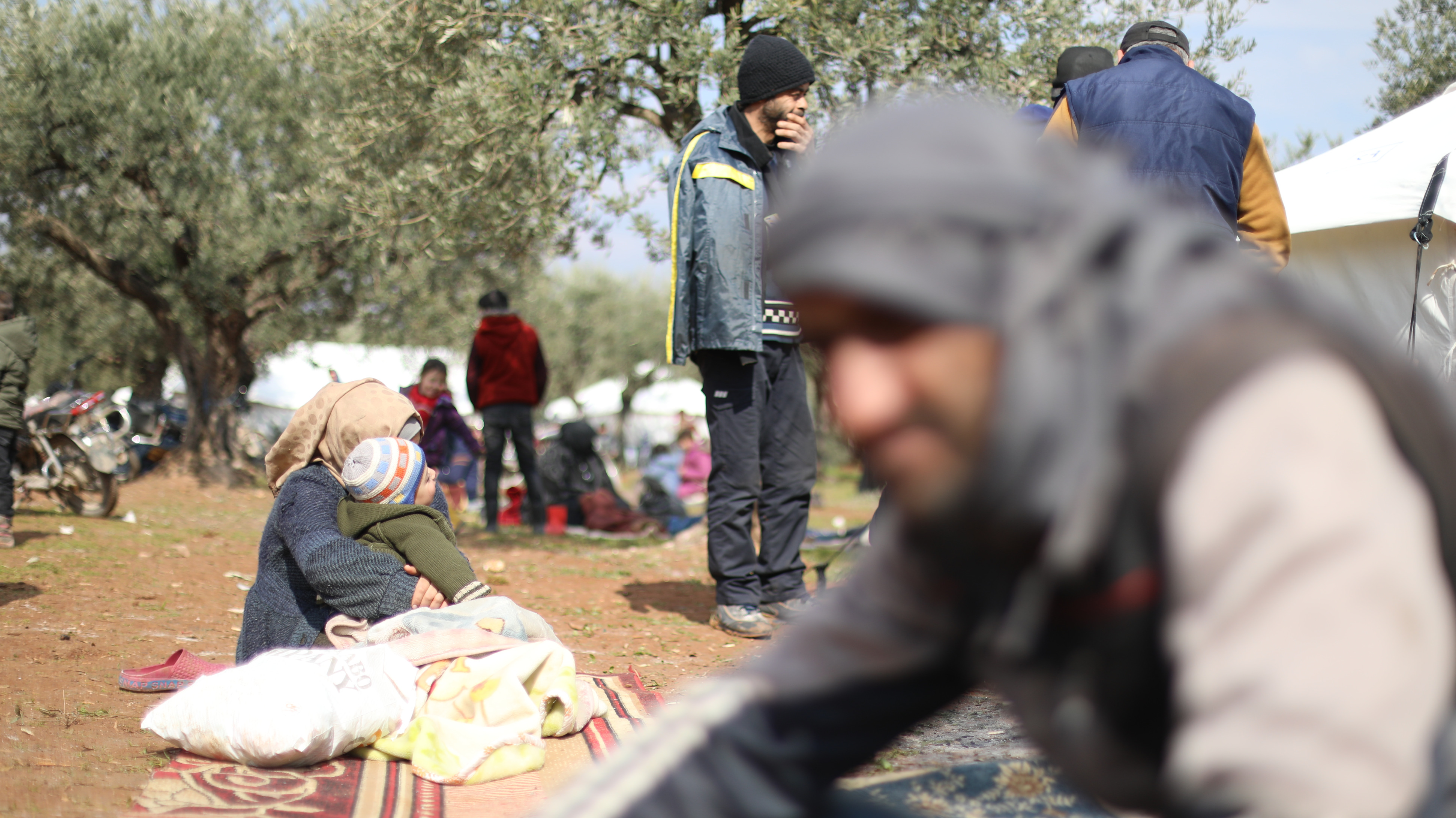 Displaced Syrians in Azmarin, western Idlib, on 12 February 2023. (MEE/Mohamed Al-Daher)