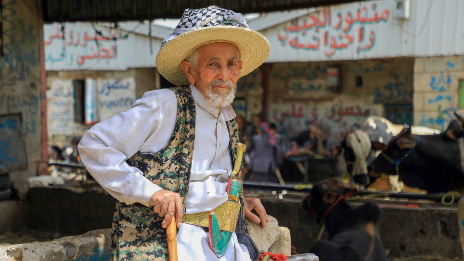 A Yemeni merchant in Sanaa prepares to sell his livestock ahead of the Eid al-Adha (Mohammed Huwais/AFP)