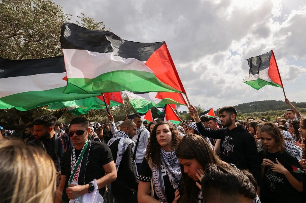 Arab Israeli protestors hold up Palestinian national flags during a demonstration near the city of Sakhnin in northern Israel, on May 5, 2022 ahead of the Palestinian marking of the 74th anniversary of the Nakba,