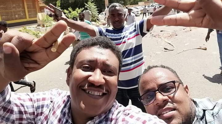 Mohammed Amin, left, with friends during the 2019 pro-democracy uprising (Supplied)