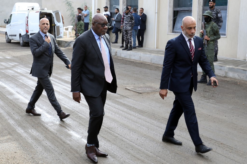 Abdoulaye Bathily (C), the UN special representative for Libya, arrives for an election simulation meeting in Tripoli on 5 November 2022 (AFP)