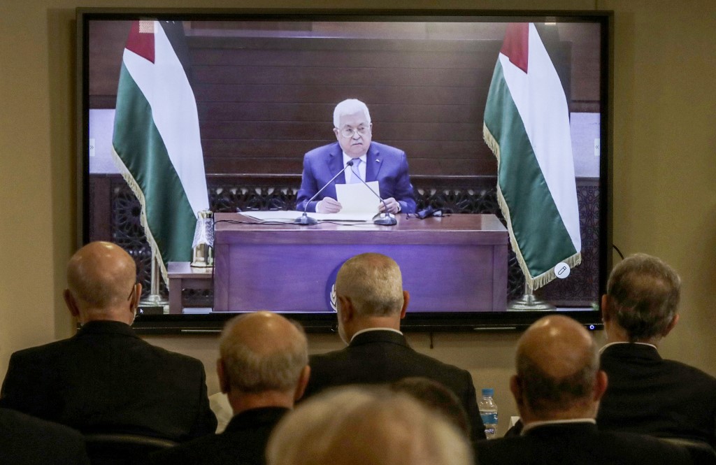 Representatives of Palestinian factions gather in Beirut on 3 September for a video conference with President Mahmoud Abbas and other representatives in Ramallah (AFP)