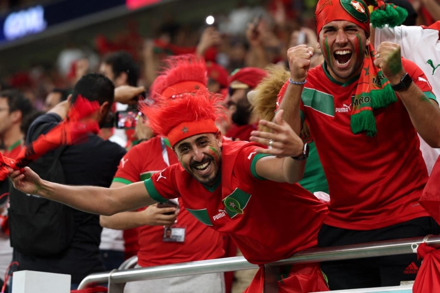 Morocco fans cheer during the Qatar 2022 World Cup Group F football match between Belgium and Morocco at the Al-Thumama Stadium in Doha on 27 November 2022 (AFP)