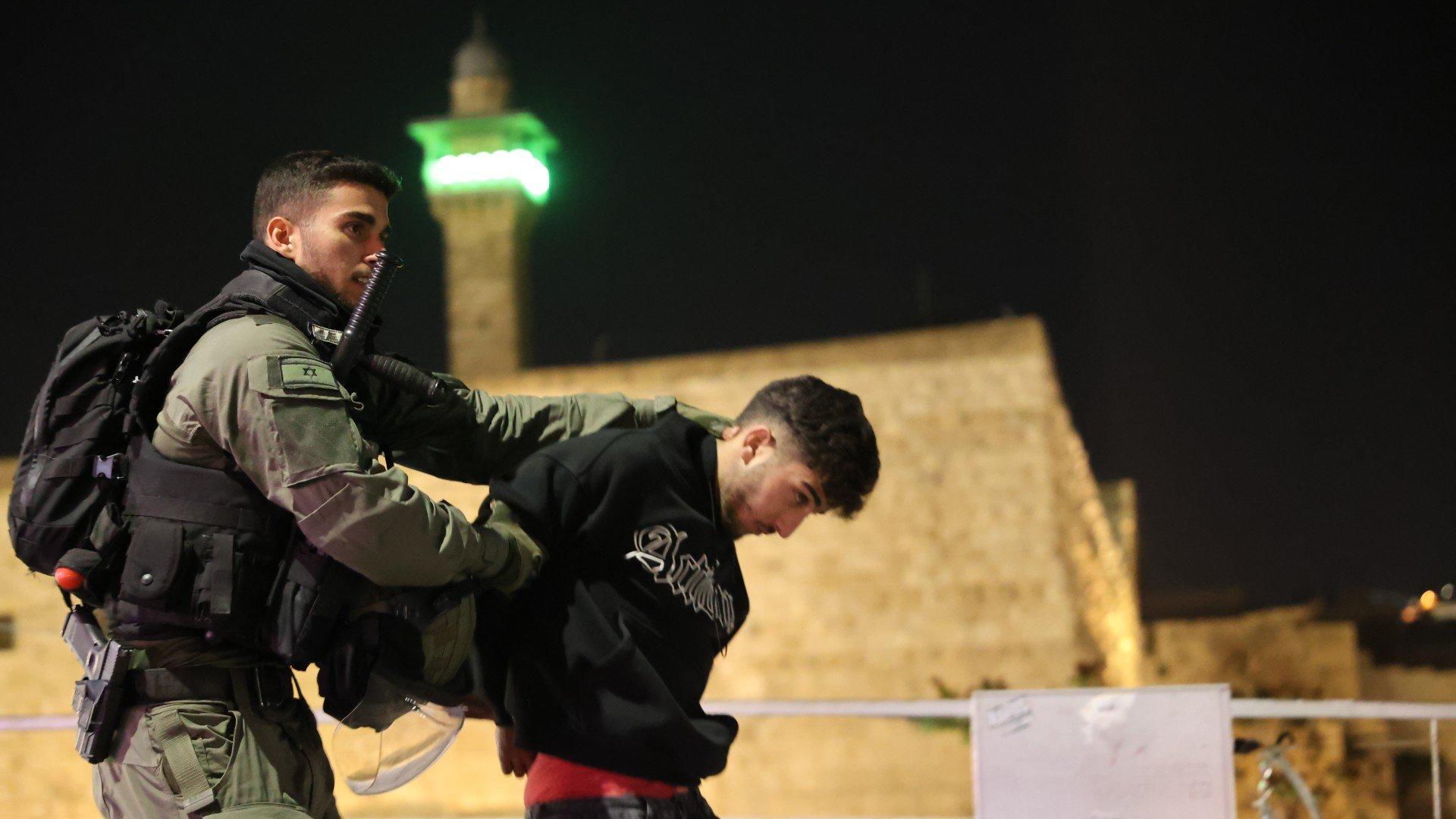 Israeli police detain Palestinians after raiding Al-Aqsa Mosque in East Jerusalem on 4 April (Anadolu Agency)