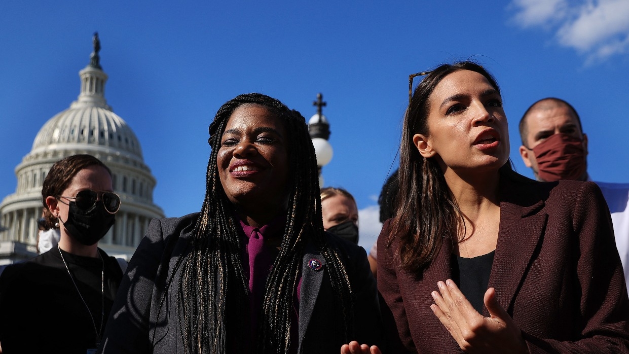 Congresswomen Cori Bush (centre) and Alexandria Ocasio-Cortez talk to reporters outside the US Capitol on 30 September 2021 in Washington DC.