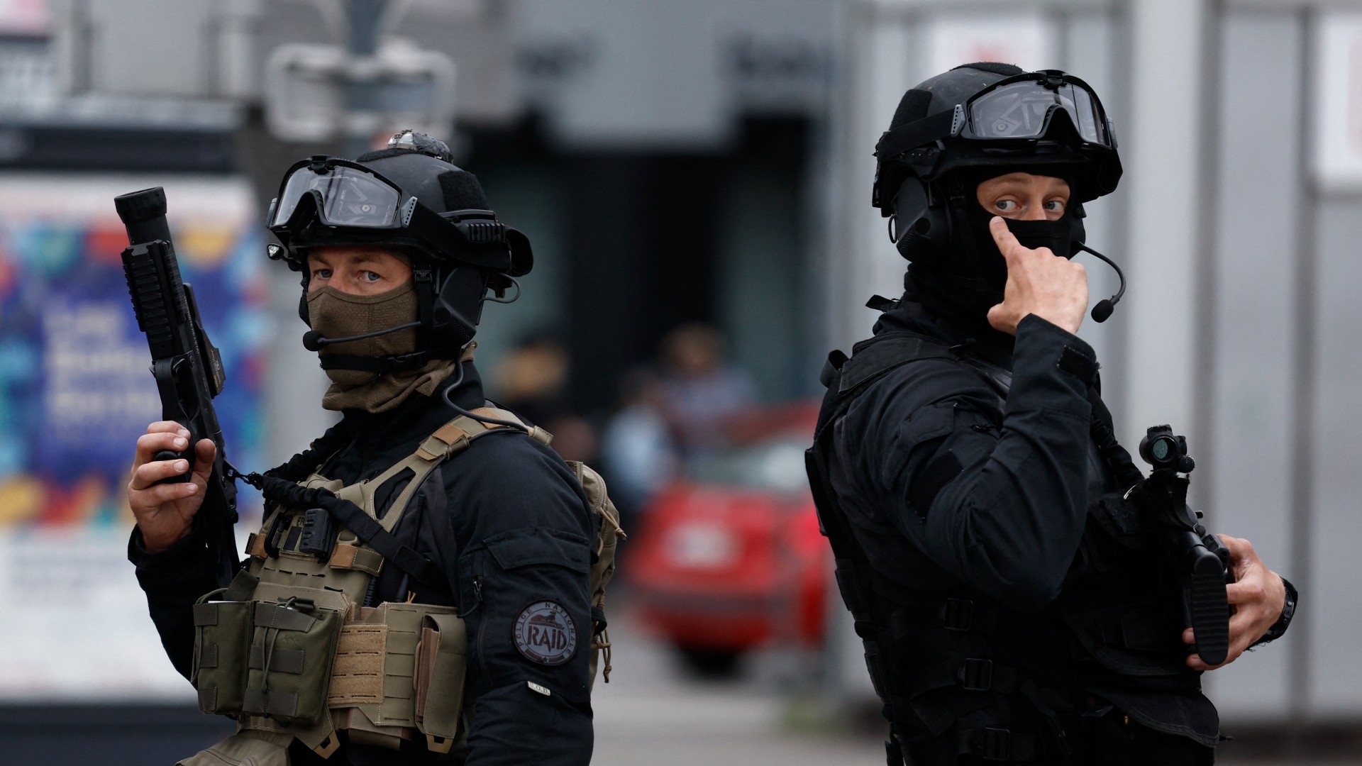 French officers patrol the street in Lille, northern France, on 30 June 2023 (AFP)