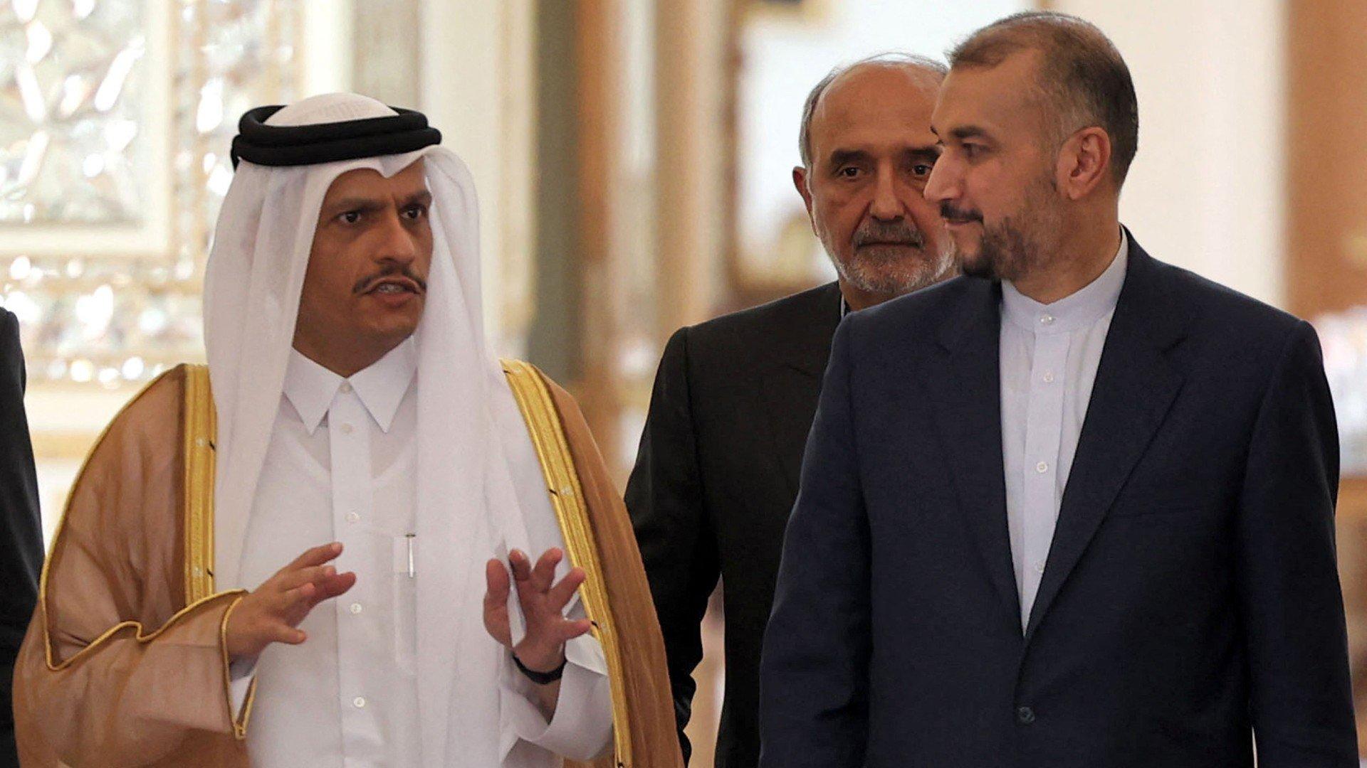 (R to L) Iran's Foreign Minister Hossein Amir-Abdollahian and Qatar's Foreign Minister Mohammed bin Abdulrahman al-Thani arrive for a joint press conference in Tehran on 7 July 2022.