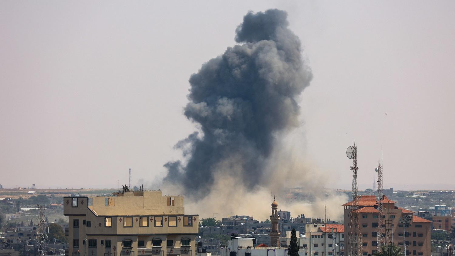 Smoke billows following Israeli military strikes on Islamic Jihad targets in Rafah, in the southern Gaza Strip, on 10 May 2023.
