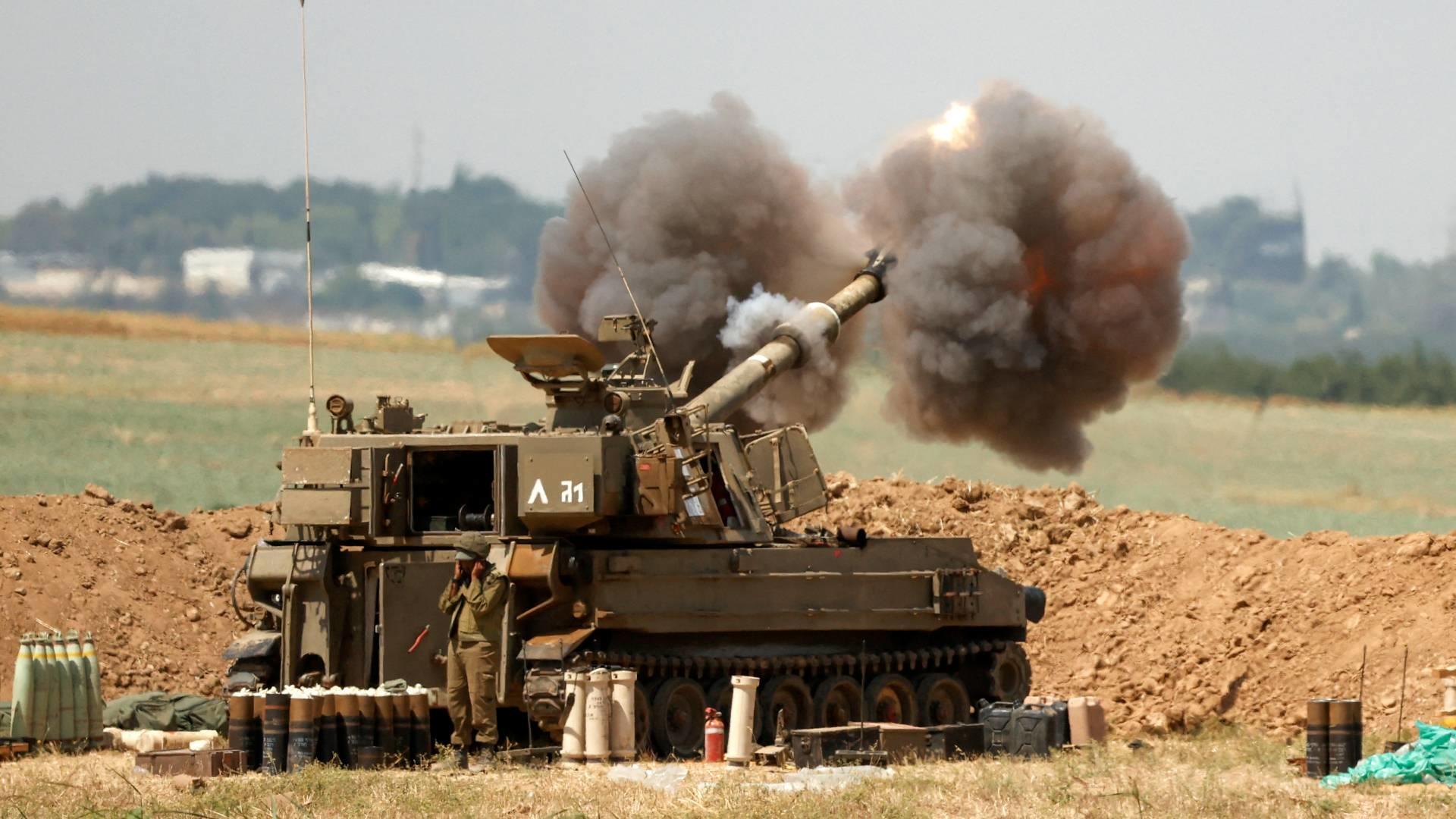 An Israeli 155mm self-propelled howitzer fires artillery shells towards the Gaza Strip on 20 May 2021.