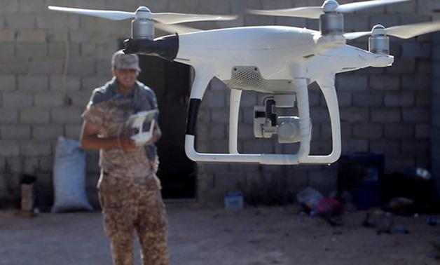 Libyan fighter operating a drone